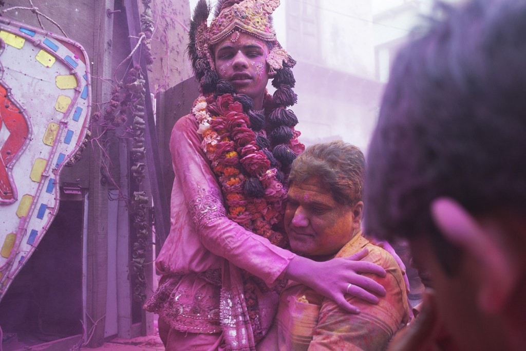 A boy dressed as Krishna
