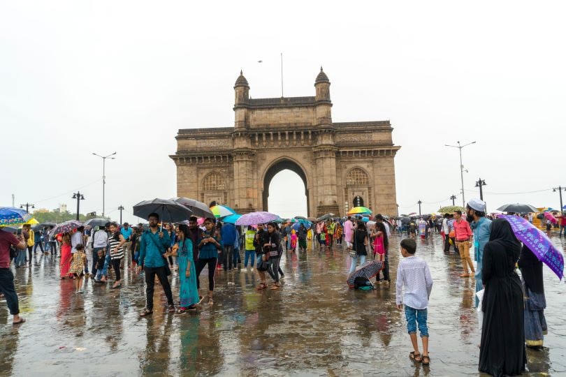 Locals enjoying the showers at the Gateway Of India.