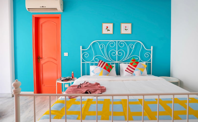 The vibrant tones in the bedroom make your stay special.