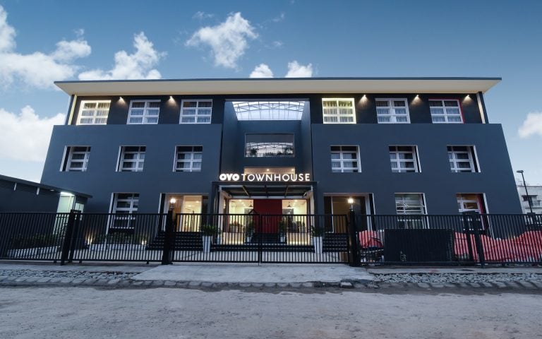 How are companies using OYO Townhouse for their employees and saving money along with multiple other benefits